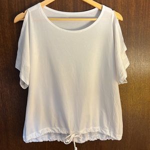Lululemon short-sleeved tee with peekaboo shoulders and tie bottom. Size 10.
